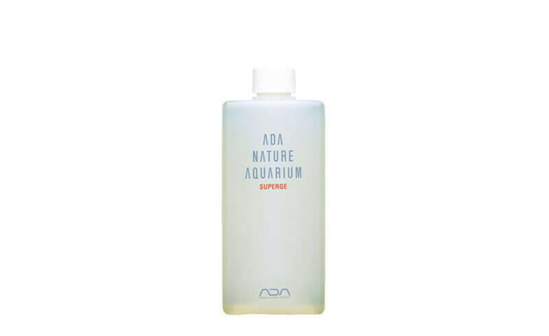 Front-facing image of ADA Superge aquarium cleaning solution in a clear plastic bottle with minimalist labeling and white cap