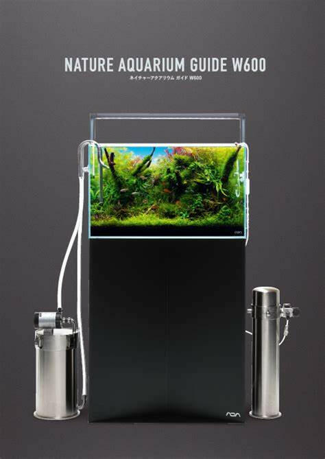 Cover of ADA Nature Aquarium Guide W600 (English) featuring a fully aquascaped 60cm ADA aquarium setup with filtration and CO₂ system on a dark background