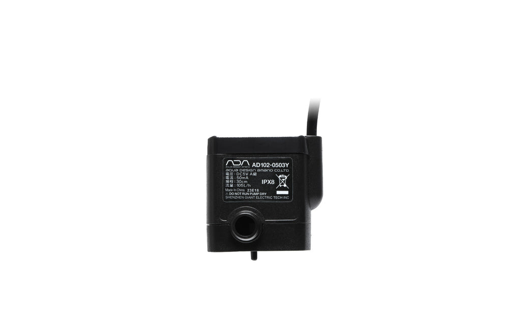 Front view of the ADA Stream Pump Mini (Model AD102-0503Y) showing the product label, water inlet, and power cable, designed for compact and efficient aquarium water circulation.