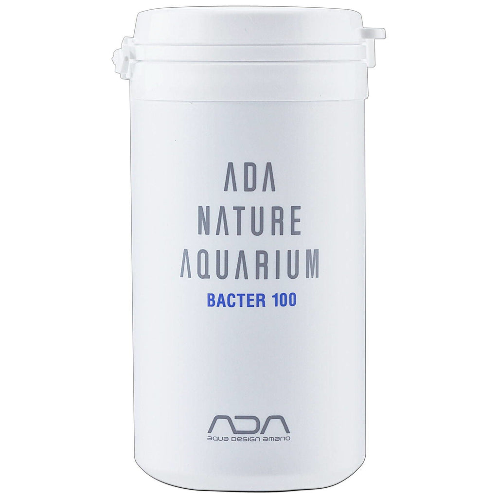 ADA Bacter 100 (100g) in a white cylindrical container with minimalist ADA Nature Aquarium branding, designed for biological substrate enhancement

